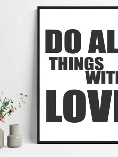 "Do All Things With Love" poster. Black text on white background, framed. Minimalist design. Vases with flowers are placed near the poster.