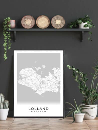 Framed Lolland, Denmark map poster. Neutral gray tones, minimalist design, black frame. Interior decor with plants and shelf detail.