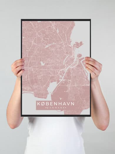 København plakat: Pink city map in black frame held by hands. Minimalist design. Great home decor for Copenhagen lovers.